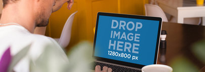 MacBook Pro Mockup of a Man Having a Coffee 14114w