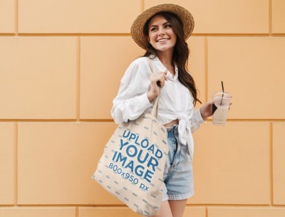 Mockup of a Female Tourist Carrying a Tote Bag 41718-r-el2