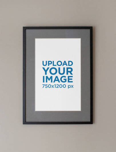Mockup of a Framed Art Print Hanged on a Grey Wall