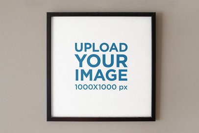 Mockup of a Squared Art Print on a Plain-Color Wall