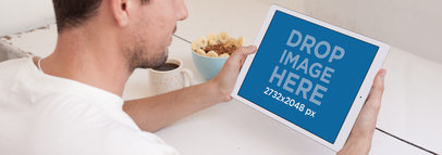 iPad Pro Mockup Featuring a Young Man Having Breakfast a14130wide