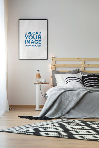 Mockup of an Art Print Hanging in a Modern Bedroom 