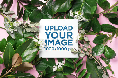 Mockup of a Square Art Print Surrounded by Green Leaves 36423-r-el2