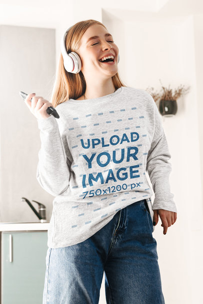 Mockup Featuring a Woman with a Sweatshirt Singing at Home 