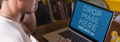 Over Shoulder Mackbook Mockup Featuring a Man at a Coffee Shop 14119