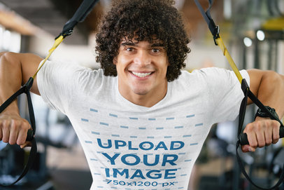 T-Shirt Mockup of a Curly-Haired Man Training at the Gym