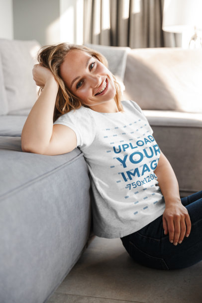 T-Shirt Mockup of a Smiling Woman in Her Living Room