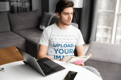 T-Shirt Mockup of a Young Man Working From Home 