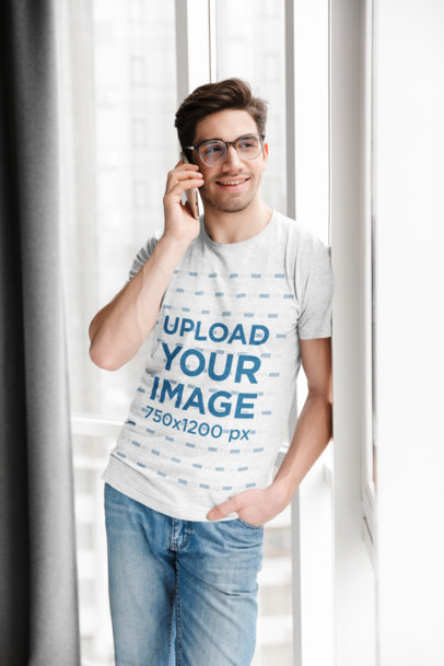T-Shirt Mockup Featuring a Man with Glasses on the Phone