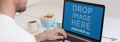 MacBook Mockup Of A Young Man Having Breakfast 14127