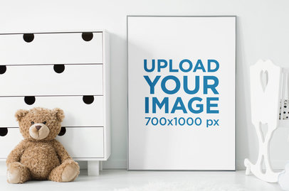 Art Print Mockup Placed Between a Crib and a Teddy Bear 