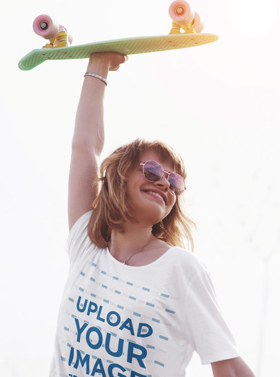 T-Shirt Mockup of a Woman Holding a Penny Board