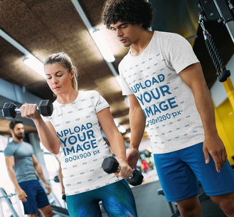 T-Shirt Mockup of a Coach Training a Woman at the Gym