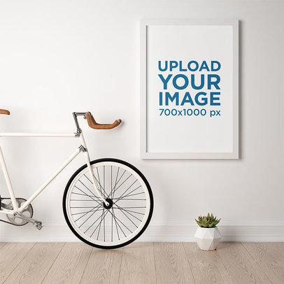 Mockup of a Framed Art Print Hanging Next to a Bike