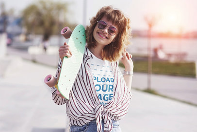T-Shirt Mockup of a Happy Woman Carrying a Board in Her Hand