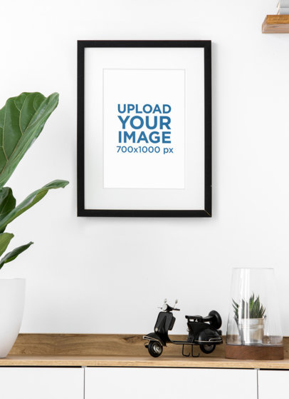 Mockup of an Art Print Hanging Over a Furniture