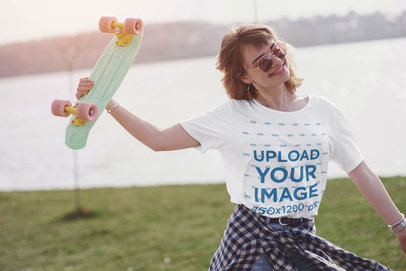 Unisex T-Shirt Mockup of a Joyful Female Skater by a Lake 