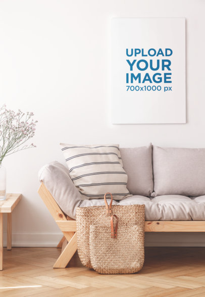 Mockup of an Art Print Placed Above a Minimalist Sofa 