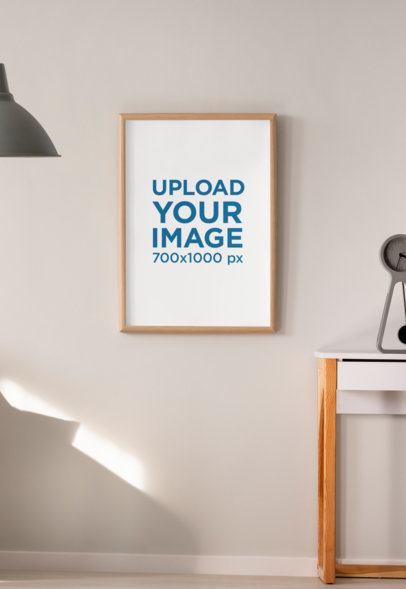 Mockup of an Art Print Hanged on a Natural Illuminated Wall 