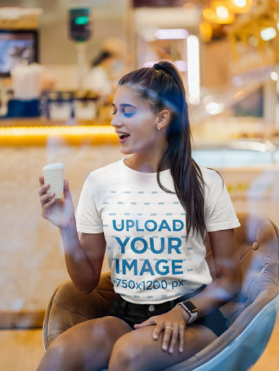 T-Shirt Mockup of a Long-Haired Woman at an Ice-Cream Shop 