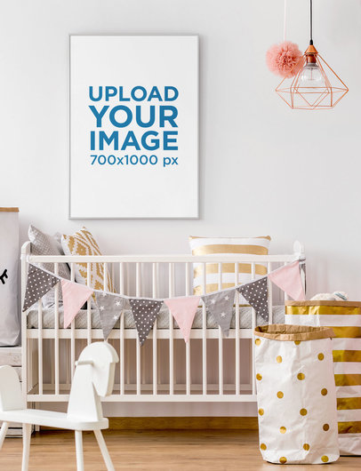 Mockup of a Vertical Art Print Hanging over a Baby Crib