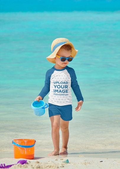 Raglan Long Sleeve Tee Mockup Featuring a Kid Playing at the Beach 