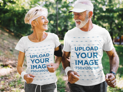 T-Shirt Mockup of a Senior Couple Jogging in Nature