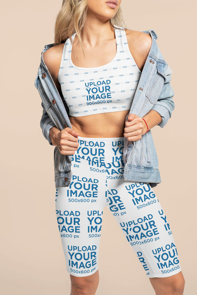 Sports Bra and Bike Shorts Mockup of a Woman Posing at a Studio