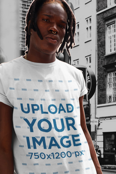 Collage-Style T-Shirt Mockup of a Man with a Nose Piercing Posing in the City