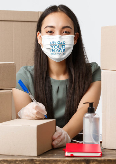 Face Mask Mockup of a Young Woman Surrounded by Shipping Boxes 42851-r-el2