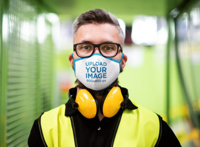 Face Mask Mockup Featuring a Man Wearing Safety Gear 