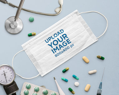 Mockup of a Face Mask Surrounded by Medical Supplies