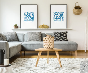 Mockup of Two Framed Art Prints Placed on a Shelf 
