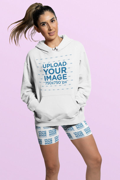 Hoodie Mockup of a Woman Wearing Bike Shorts at a Studio