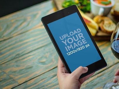Nexus 7 Mockup Featuring a Woman at a Bistro