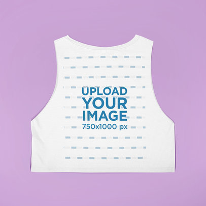 Mockup of a Sleeveless Crop Top Lying on a Customizable Surface 