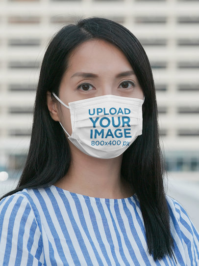Face Mask Mockup Featuring a Long-Haired Woman in a City