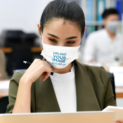 Face Mask Mockup of a Woman Focused at Work 