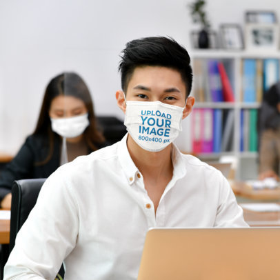 Mockup of a Man Wearing a Face Mask at an Office 41989-r-el2