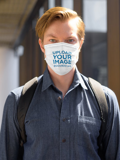 Mockup of a Serious Man Wearing a Sublimated Face Mask