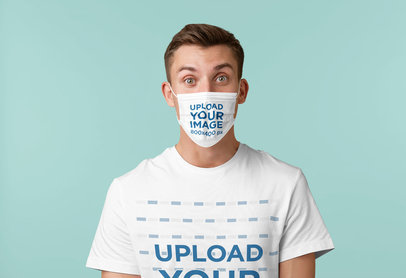 Mockup of a Young Man Wearing a T-Shirt and a Face Mask in a Studio