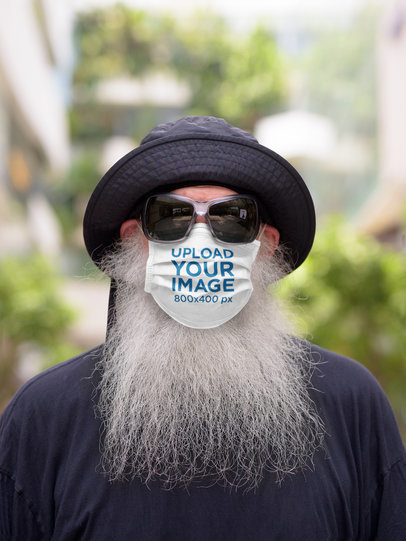 Mockup of a Senior Bearded Man Wearing a Customizable Face Mask 