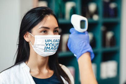 Mockup Featuring a Long-Haired Woman Wearing a Customizable Face Mask 