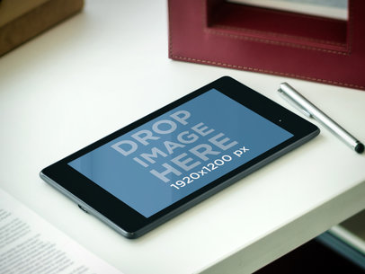 Mockup of a Nexus 7 in Landscape Position Lying on a Workstation