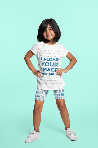 Bike Shorts Mockup of a Happy Girl Wearing a T-Shirt Against a Colored Backdrop