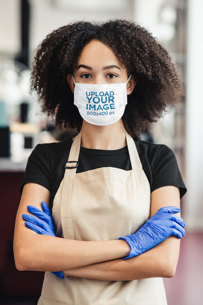 Face Mask Mockup Featuring a Female Worker With Her Arms Crossed