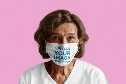 Sublimated Face Mask Mockup Featuring a Senior Woman at a Studio