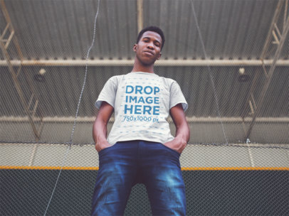 Young Man Looking down While Wearing a Tshirt Mockup