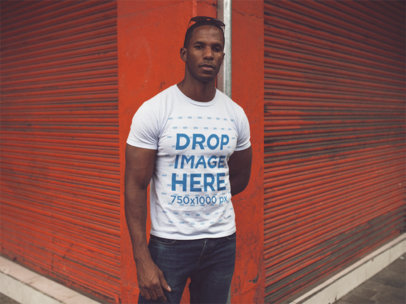 Serious Man Wearing a Round Neck Tee While Standing near Orange Blinds Mockup