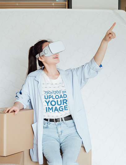 T-Shirt Mockup Featuring a Young Woman Wearing a VR Headset Device at Home 42615-r-el2